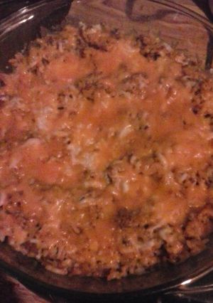 A picture of Cheesy chorizo Spanish rice bake.