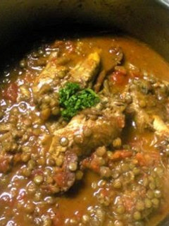 A picture of Chicken Wings Stewed in Tomato Sauce with Lentils.