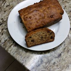 A picture of Banana bread with walnuts & chocolate chip.