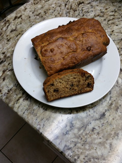 A picture of Banana bread with walnuts & chocolate chip.