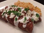 A picture of chicken mole enchiladas