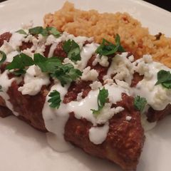 A picture of Chicken chipotle mole enchiladas.