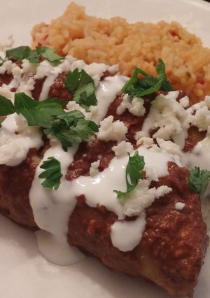 A picture of Chicken chipotle mole enchiladas.