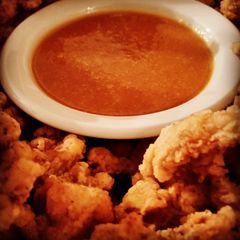 A picture of Popcorn Chicken Thighs with Tangy Sweet and Sour Sauce.