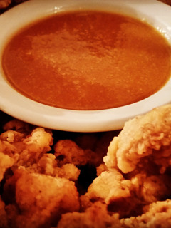 A picture of Popcorn Chicken Thighs with Tangy Sweet and Sour Sauce.