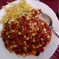 A picture of Githeri served with steamed cabbage.