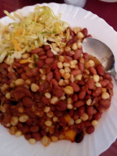 A picture of Githeri served with steamed cabbage.