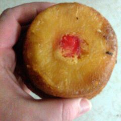 A picture of pineapple upside down cupcake/muffin.