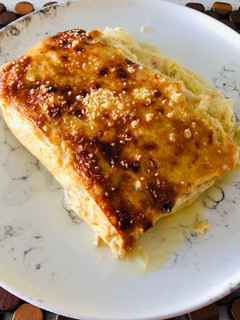 Una foto de Pastel de cebollas y queso