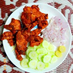 A picture of The Spicy Tawa Chicken Fry phaal.
