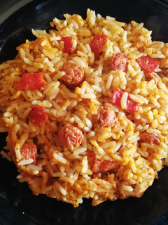 Una foto de Arroz con chistorras y piquillos al brandy