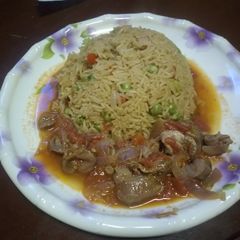 A picture of Gizzards Stew + Rice.