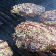 A picture of Grilled Burgers at their finest!.