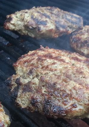 A picture of Grilled Burgers at their finest!.