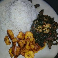 A picture of White Rice with Efo riro and plaintain #Oyostate.