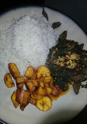 A picture of White Rice with Efo riro and plaintain #Oyostate.