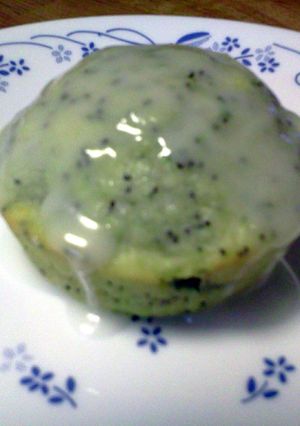 A picture of Lemon Poppy Zucchini Muffins with Lemon Glaze.