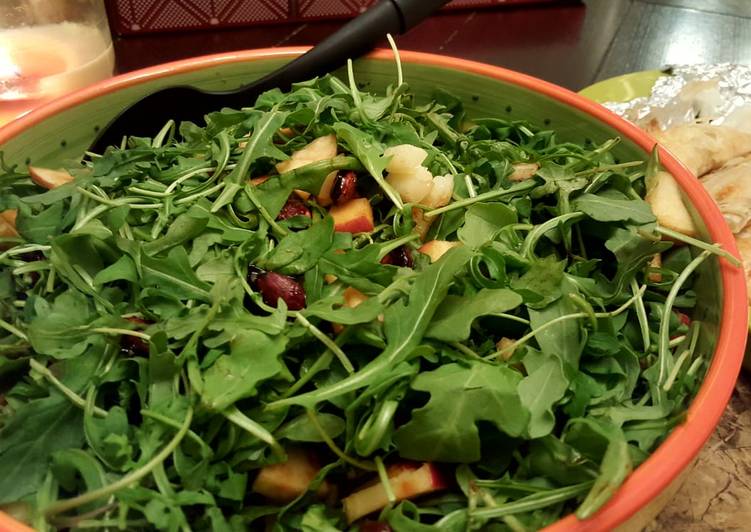Arugula salad with candied almonds,walnuts,dates and apple