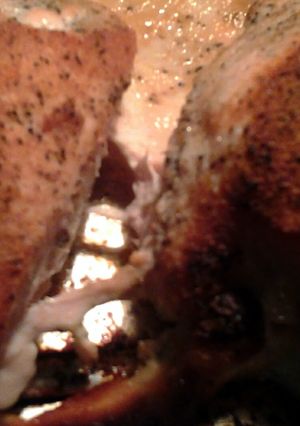 A picture of baked chicken with rub.