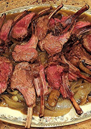 A picture of Rack of Lamb On Onions & Mushrooms with White Wine & Lamb Stock Sauce.
