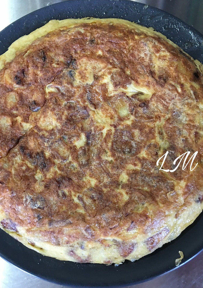 Una foto de Tortilla de patatas con cebolla