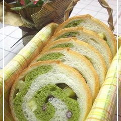 A picture of Rolled Matcha Bread with Sweet Potatoes and Adzuki.