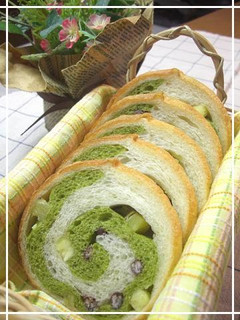 A picture of Rolled Matcha Bread with Sweet Potatoes and Adzuki.