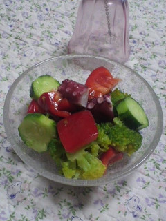 A picture of Marinated Octopus and Broccoli.