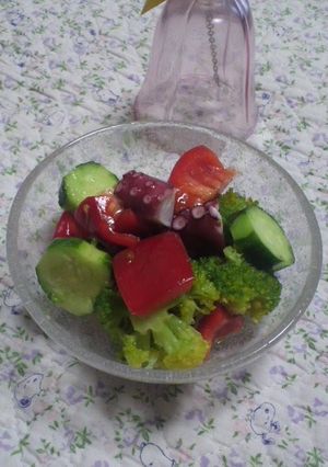 A picture of Marinated Octopus and Broccoli.