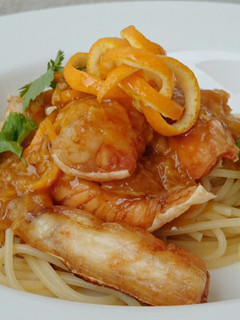 A picture of Spaghetti And Salmon In Orange Ginger Sauce.