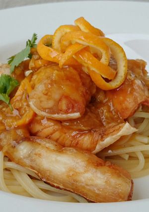 A picture of Spaghetti And Salmon In Orange Ginger Sauce.
