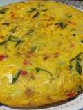 Tortilla de patatas con pimientos rojos y collejas