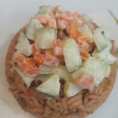 A picture of Jollof rice and coleslaw.