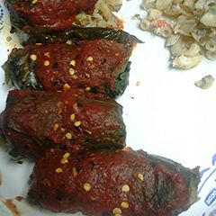 A picture of Stuff grape leaves with meat and rice.