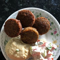 A picture of Falafel with hummus and tahini salad what 3 recipes yummy.
