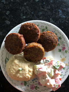 A picture of Falafel with hummus and tahini salad what 3 recipes yummy.
