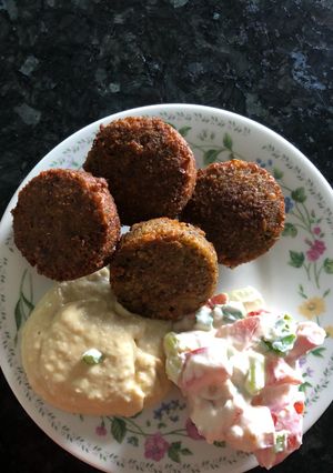 A picture of Falafel with hummus and tahini salad what 3 recipes yummy.
