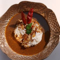 A picture of Authentic Kollu Rasam with Rice.