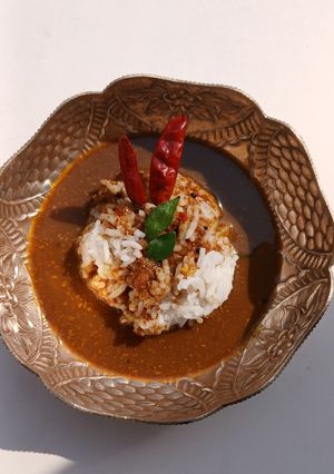 A picture of Authentic Kollu Rasam with Rice.