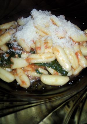 A picture of Cavatelli with tomato - basil sauce.