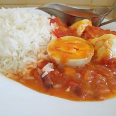 A picture of Egg Curry with Rice.