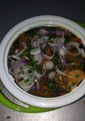 A picture of Isi ewu (goat head) in potash sauce.