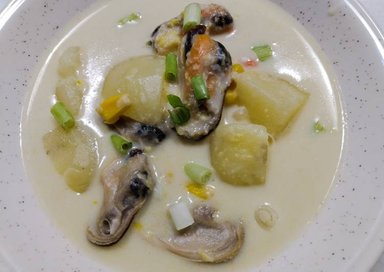 Seafood chowder with coconut, corn and mussels