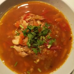 A picture of Lentil soup with shredded roast chicken.