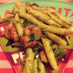 A picture of Smoked penne and shrimp in pesto sauce.