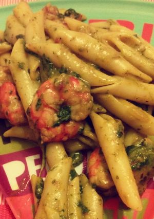 A picture of Smoked penne and shrimp in pesto sauce.