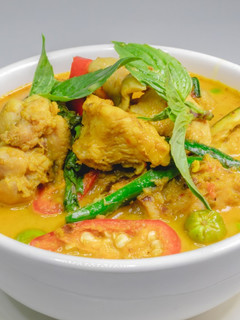 A picture of Thai Green Curry Chicken with Beautifully Separated Coconut Oil and Fresh Eggplant.
