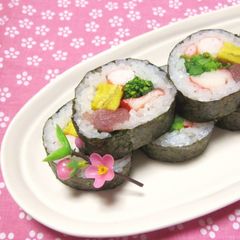 A picture of Doll's Festival Seafood Futomaki Sushi Rolls with Nanohana.
