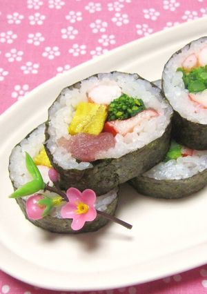 A picture of Doll's Festival Seafood Futomaki Sushi Rolls with Nanohana.