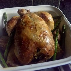 A picture of Sophie's garlic roast chicken, paprika carrots & asparagus and scored potatoes..